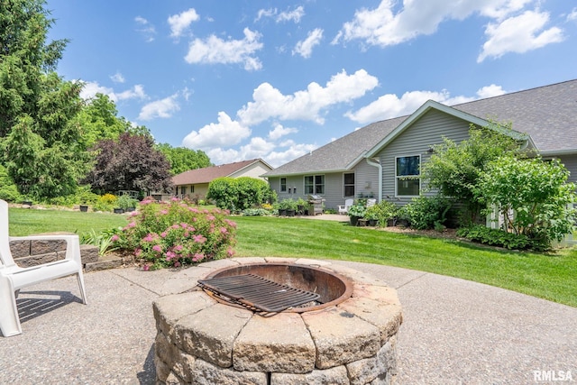 10984 150th St, Davenport, IA 52804 - view of patio with a fire pit