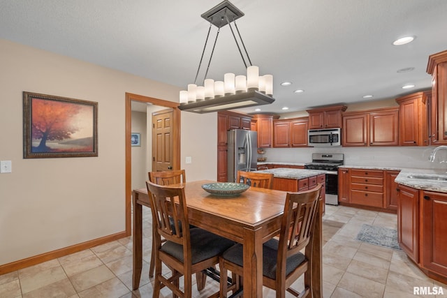 10984 150th St, Davenport, IA 52804 - dining space featuring baseboards and recessed lighting