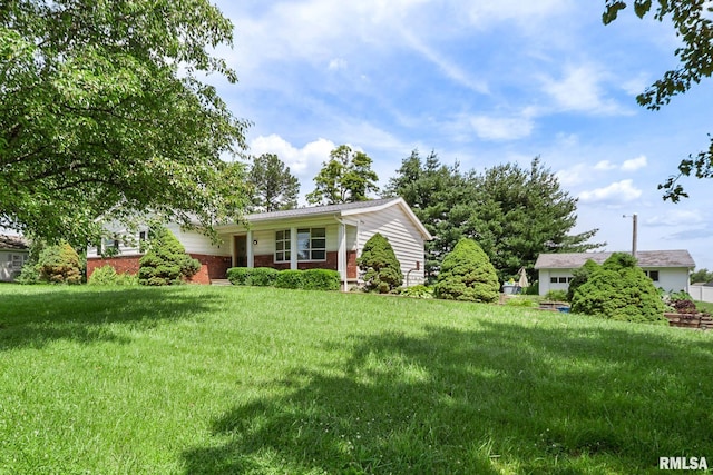 1406 Golf Course Rd, Marion, IL 62959 - view of front of home with brick siding and a front lawn