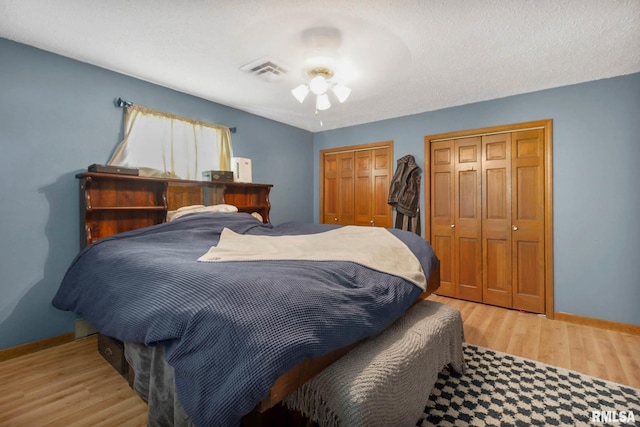 1406 Golf Course Rd, Marion, IL 62959 - bedroom with multiple closets and light wood-style flooring