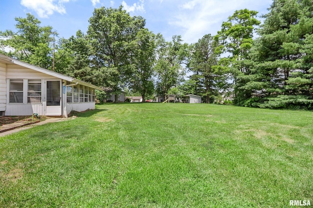 1406 Golf Course Rd, Marion, IL 62959 - view of green lawn with a sunroom