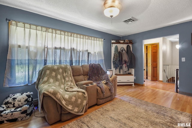 1406 Golf Course Rd, Marion, IL 62959 - living area featuring wood finished floors and a textured ceiling