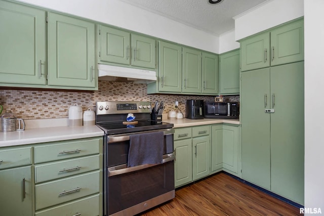 1406 Golf Course Rd, Marion, IL 62959 - kitchen with double oven range, under cabinet range hood, black microwave, green cabinetry, and light countertops