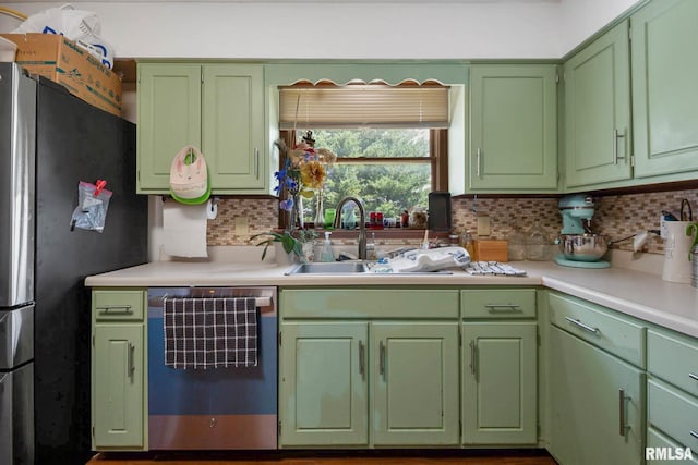 1406 Golf Course Rd, Marion, IL 62959 - kitchen featuring freestanding refrigerator, dishwashing machine, light countertops, and backsplash
