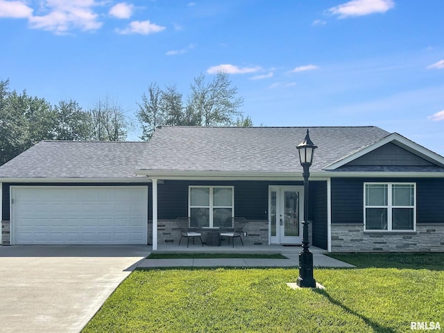 1612 N Garfield St, Marion, IL 62959 - ranch-style home with stone siding, a garage, a front lawn, and roof with shingles