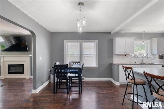 2506 N Howell St, Davenport, IA 52804 - dining space featuring dark wood-style floors and a fireplace