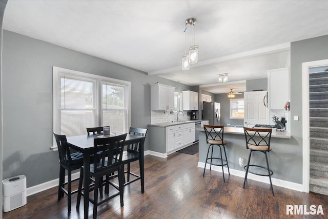 2506 N Howell St, Davenport, IA 52804 - kitchen with stainless steel appliances, healthy amount of natural light, backsplash, and a peninsula