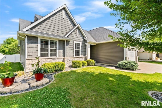6691 Spring Creek Dr, Bettendorf, IA 52722 - craftsman inspired home featuring stone siding, concrete driveway, an attached garage, and roof with shingles