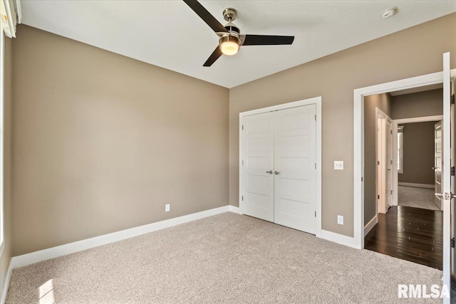 6691 Spring Creek Dr, Bettendorf, IA 52722 - unfurnished bedroom with carpet, a closet, and ceiling fan