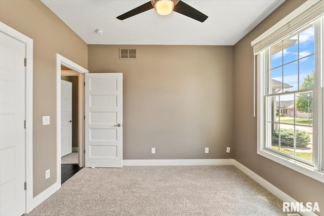 6691 Spring Creek Dr, Bettendorf, IA 52722 - carpeted spare room featuring ceiling fan and a smoke detector
