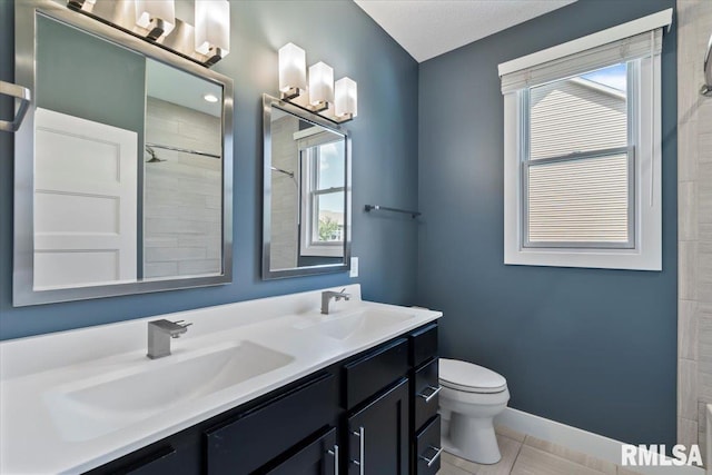 6691 Spring Creek Dr, Bettendorf, IA 52722 - full bath featuring double vanity, tiled shower, healthy amount of natural light, and tile patterned flooring