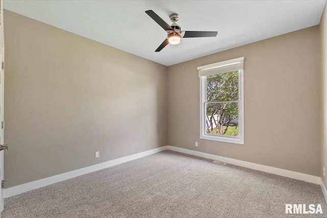 6691 Spring Creek Dr, Bettendorf, IA 52722 - unfurnished room with light colored carpet and a ceiling fan