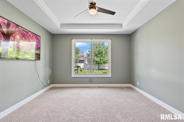 6691 Spring Creek Dr, Bettendorf, IA 52722 - carpeted spare room with a raised ceiling, a textured ceiling, ceiling fan, and ornamental molding