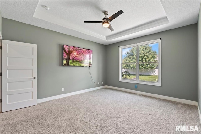 6691 Spring Creek Dr, Bettendorf, IA 52722 - carpeted empty room with a tray ceiling, a textured ceiling, a ceiling fan, and a smoke detector