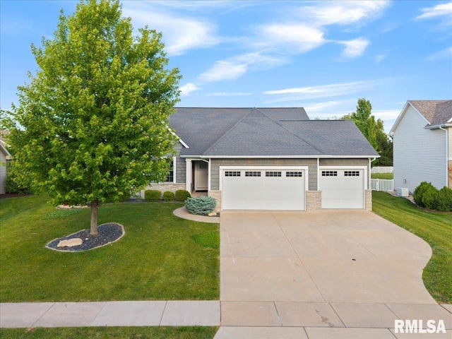 6691 Spring Creek Dr, Bettendorf, IA 52722 - view of front of house featuring a garage, driveway, a front yard, and stone siding