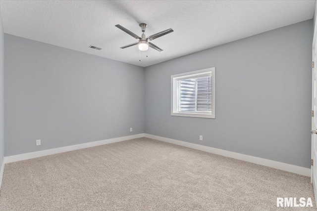 6691 Spring Creek Dr, Bettendorf, IA 52722 - unfurnished room featuring a ceiling fan, carpet floors, and a textured ceiling