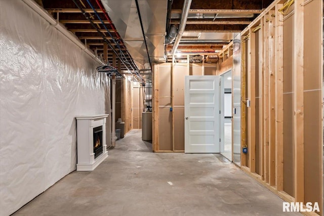 6691 Spring Creek Dr, Bettendorf, IA 52722 - unfinished basement featuring a warm lit fireplace