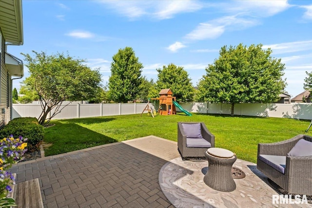 6691 Spring Creek Dr, Bettendorf, IA 52722 - fenced backyard featuring a patio area and a playground