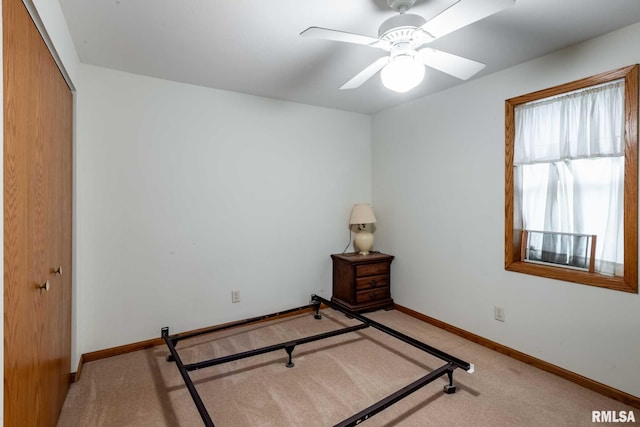 105 Laurel St, Stonefort, IL 62987 - unfurnished bedroom with a closet, light colored carpet, and ceiling fan