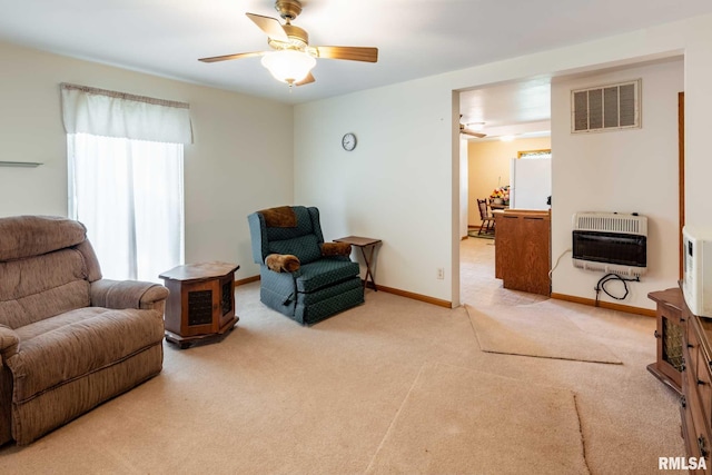 105 Laurel St, Stonefort, IL 62987 - carpeted living room with heating unit and a ceiling fan