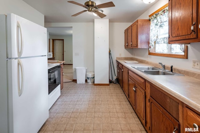 105 Laurel St, Stonefort, IL 62987 - kitchen with freestanding refrigerator, electric range oven, light countertops, and ceiling fan