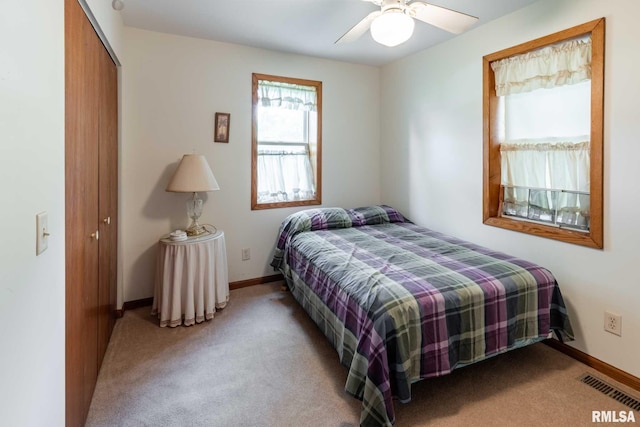 105 Laurel St, Stonefort, IL 62987 - carpeted bedroom with a closet and a ceiling fan
