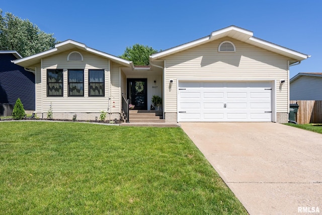 6627 Cresthill Dr, Davenport, IA 52806 - ranch-style house featuring concrete driveway, a front lawn, and a garage