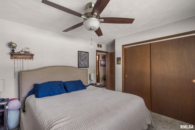 209 Hilltop St, Colona, IL 61241 - bedroom featuring a closet, a ceiling fan, and carpet