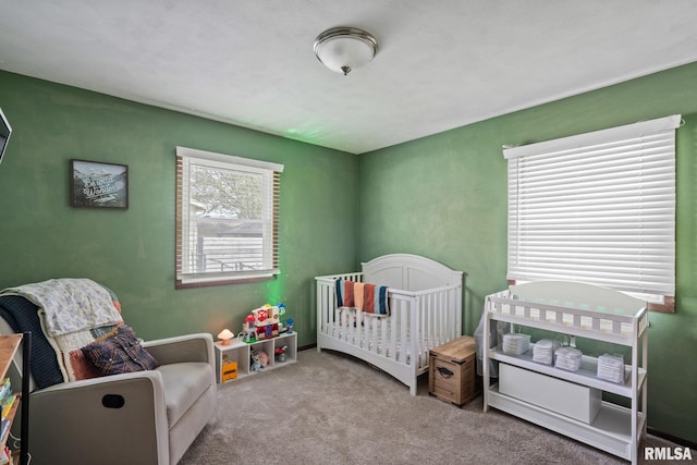 209 Hilltop St, Colona, IL 61241 - carpeted bedroom featuring a crib