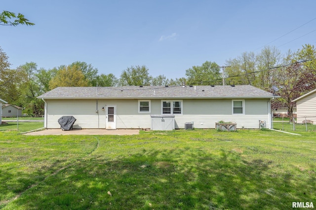 209 Hilltop St, Colona, IL 61241 - rear view of house featuring a patio and a lawn