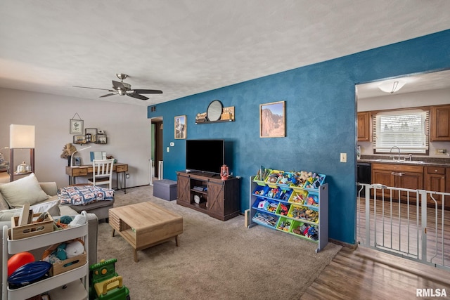 209 Hilltop St, Colona, IL 61241 - living area featuring a ceiling fan and wood finished floors