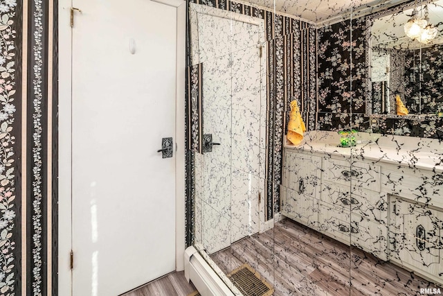 2305 Weaver Rd, Herrin, IL 62948 - bathroom featuring wood finished floors, a shower stall, and double vanity