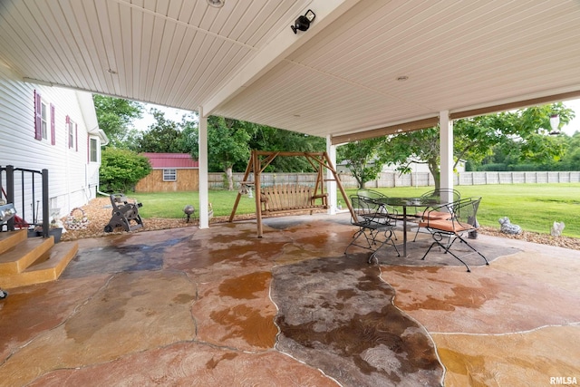 2305 Weaver Rd, Herrin, IL 62948 - fenced backyard featuring a patio area, an outdoor structure, and outdoor dining space