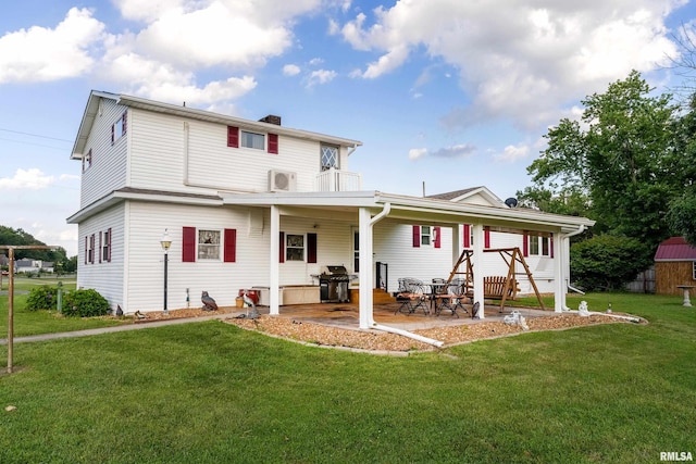 2305 Weaver Rd, Herrin, IL 62948 - rear view of property with a lawn, a patio area, a chimney, and a balcony
