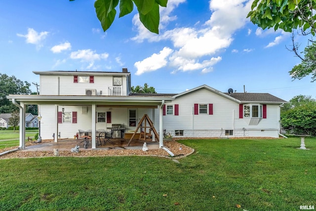 2305 Weaver Rd, Herrin, IL 62948 - back of house featuring a patio area, a lawn, and a chimney