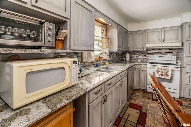 2305 Weaver Rd, Herrin, IL 62948 - kitchen featuring white appliances, under cabinet range hood, backsplash, and gray cabinetry