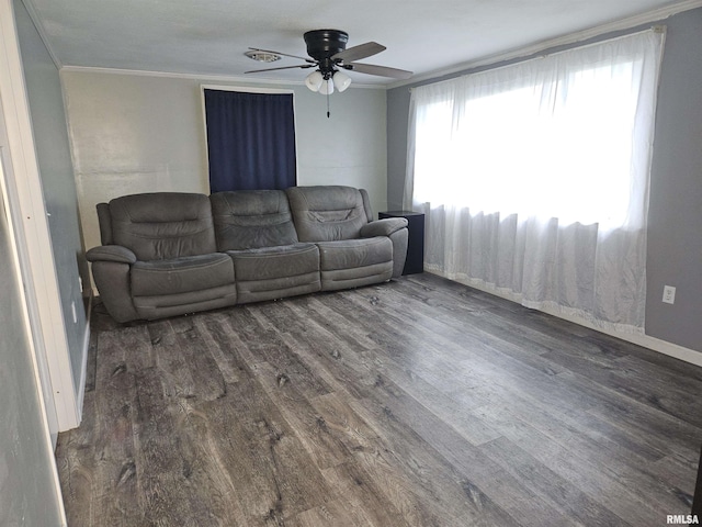 2409 9th St, Silvis, IL 61282 - living room with wood finished floors, a ceiling fan, and ornamental molding