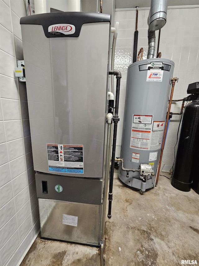 2409 9th St, Silvis, IL 61282 - utility room featuring heating unit and gas water heater