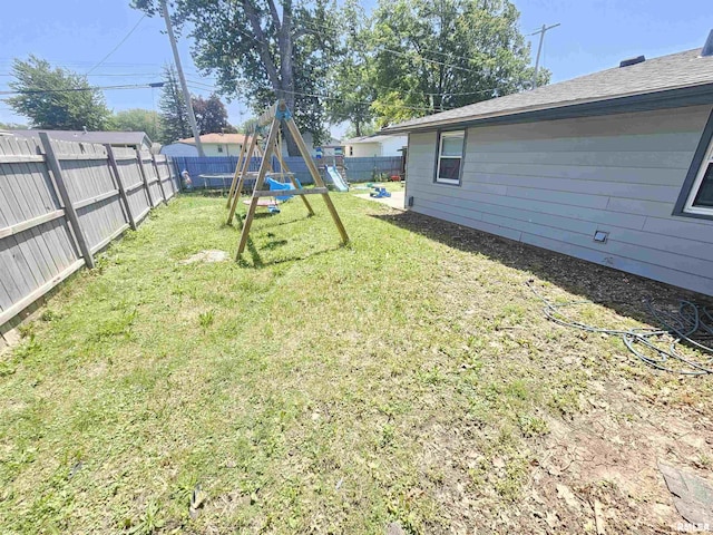 2409 9th St, Silvis, IL 61282 - fenced backyard with a playground