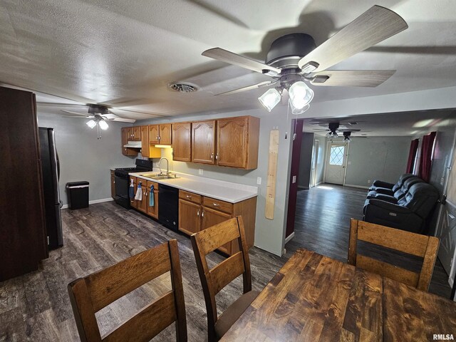 2409 9th St, Silvis, IL 61282 - kitchen with black appliances, ceiling fan, dark wood-style flooring, and light countertops