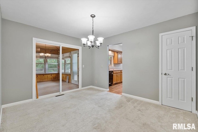 5315 34th Ave, Moline, IL 61265 - unfurnished room with a chandelier and light colored carpet