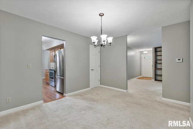 5315 34th Ave, Moline, IL 61265 - spare room with light colored carpet and a chandelier