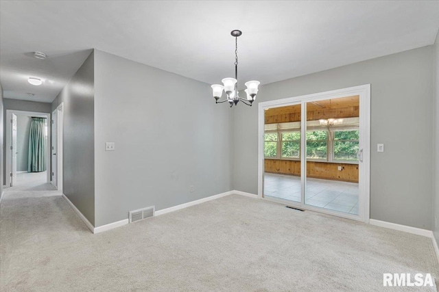 5315 34th Ave, Moline, IL 61265 - carpeted empty room with a chandelier and a smoke detector