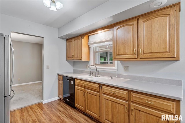 5315 34th Ave, Moline, IL 61265 - kitchen featuring freestanding refrigerator, dishwasher, light wood-type flooring, and light countertops