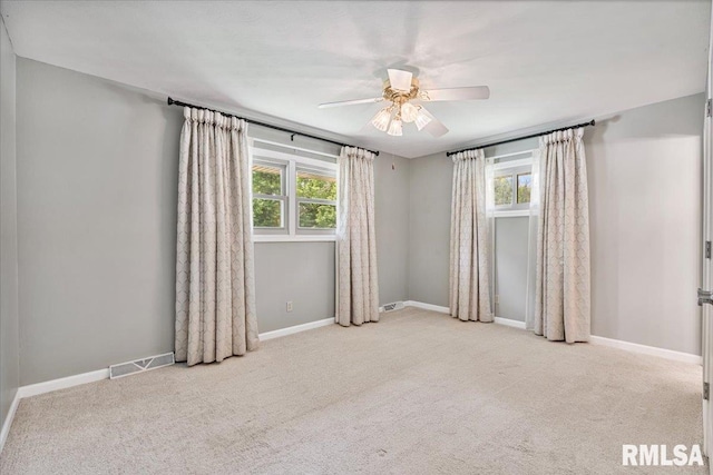 5315 34th Ave, Moline, IL 61265 - carpeted spare room featuring ceiling fan and baseboards