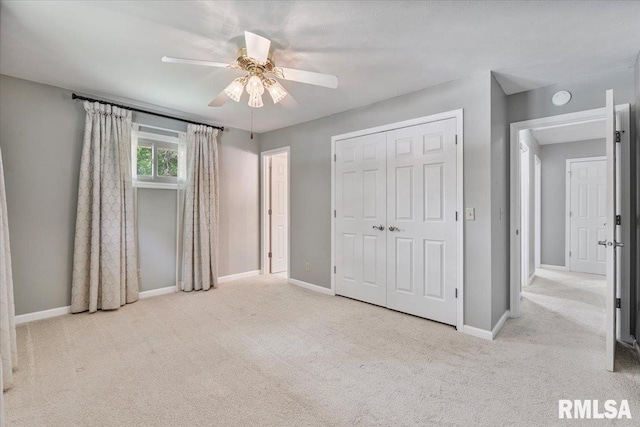 5315 34th Ave, Moline, IL 61265 - unfurnished bedroom with carpet floors, a closet, and ceiling fan