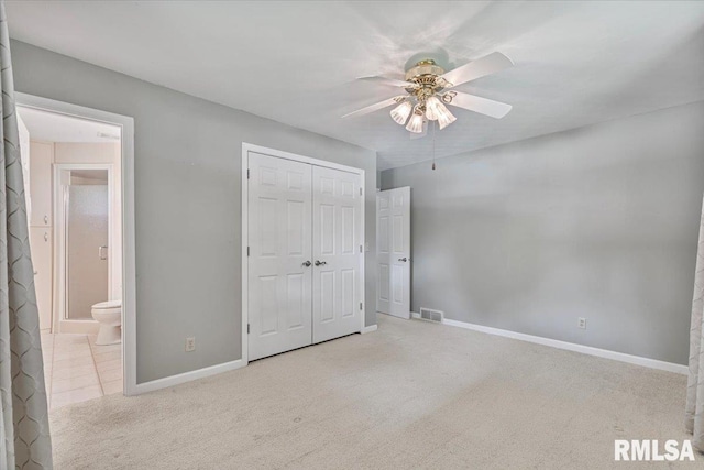 5315 34th Ave, Moline, IL 61265 - unfurnished bedroom with carpet floors, a closet, ceiling fan, and ensuite bathroom