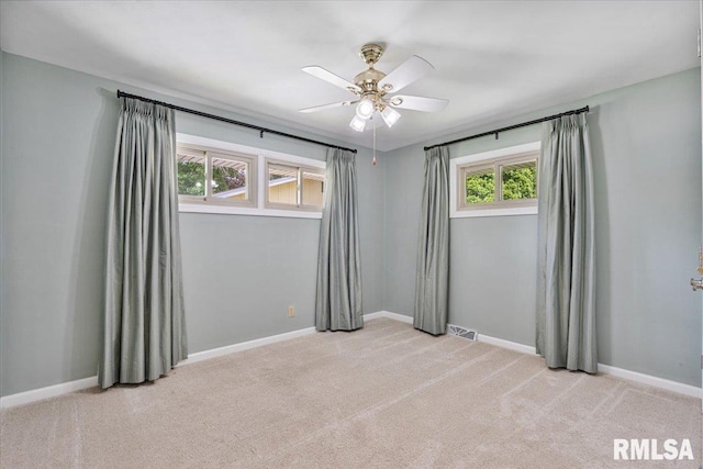 5315 34th Ave, Moline, IL 61265 - unfurnished room with light colored carpet and ceiling fan