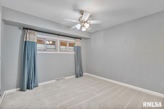 5315 34th Ave, Moline, IL 61265 - empty room featuring carpet flooring and a ceiling fan