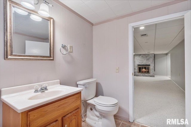 5315 34th Ave, Moline, IL 61265 - bathroom with vanity, a fireplace, and ornamental molding